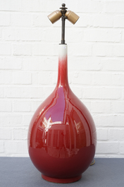 Three Chinese sang-de-boeuf-glazed bottle vases, 20th C.